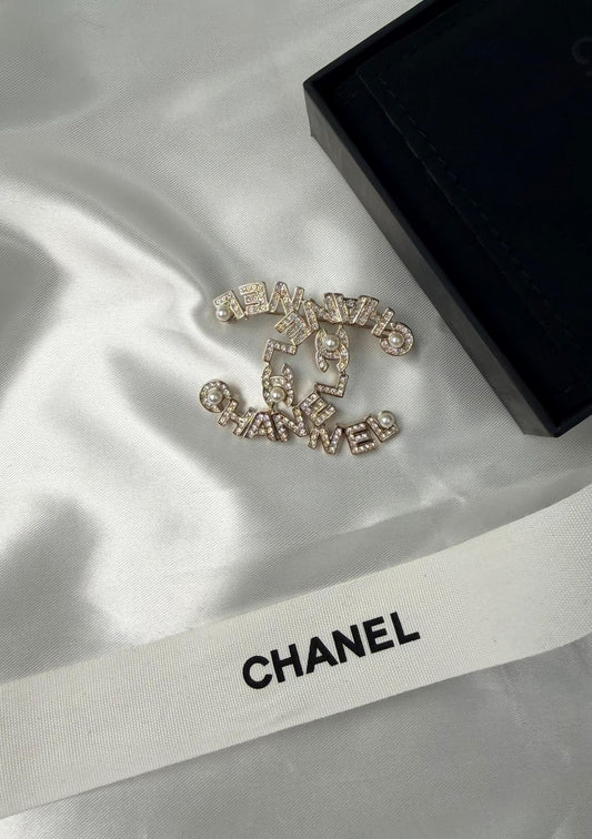 Chanel CC Ribbon & Crystal Brooch (Silver / Crystal)